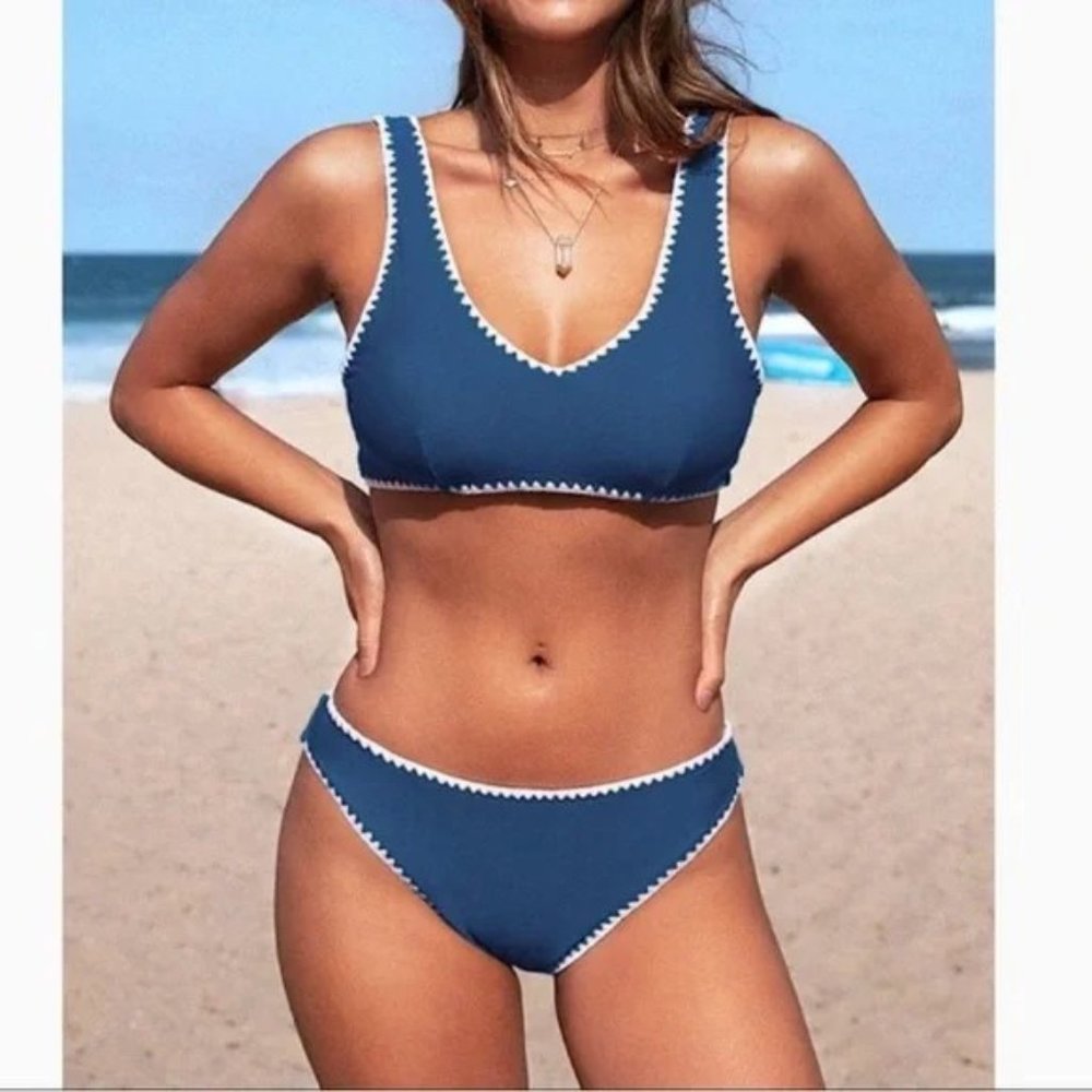 2 piece bikini swim set. Crochet look white embroidery on teal. Light pad bra.